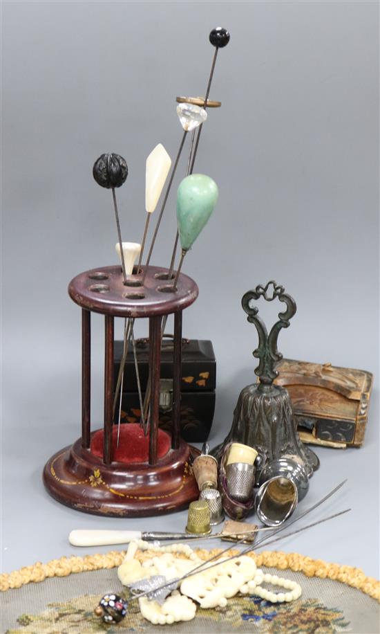 A pin stand, a pocket watch case, a lacquer scent bottle case, a hand-fan, thimbles and a bronze bell, etc.